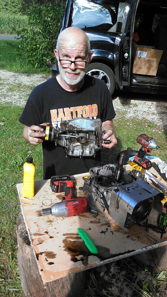 Greg, working on a Riding Mower engine